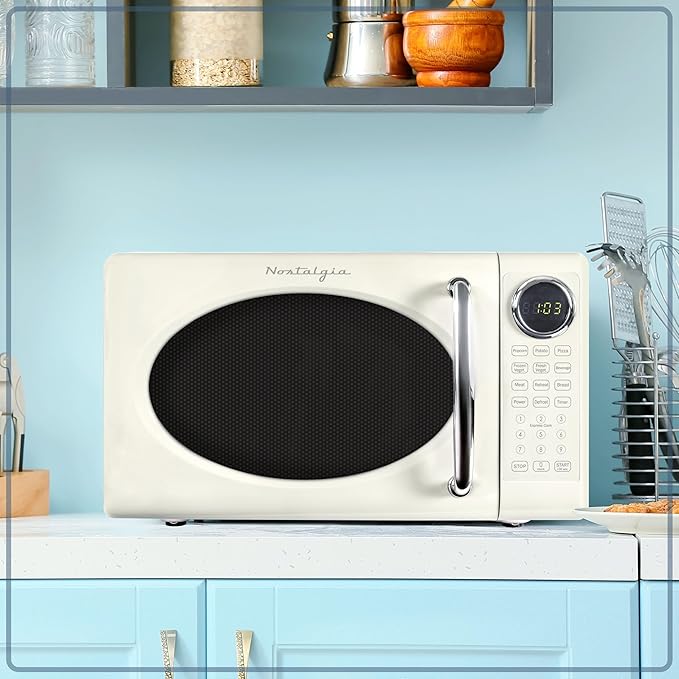 Nostalgia Retro 700W Microwave Oven 0.7 Cu Ft Capacity – Child Safety Lock, 8 Auto-Cook Settings – Countertop Kitchen Appliance – Ivory