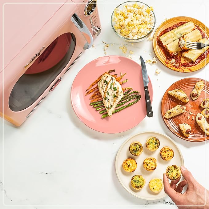 Nostalgia Retro Countertop Microwave Oven - 1.1 Cu Ft & 1000 Watt Power- Easy to Clean with Removable Glass Turntable - Child Safety Lock - 12 Programs - Digital Clock - Pink